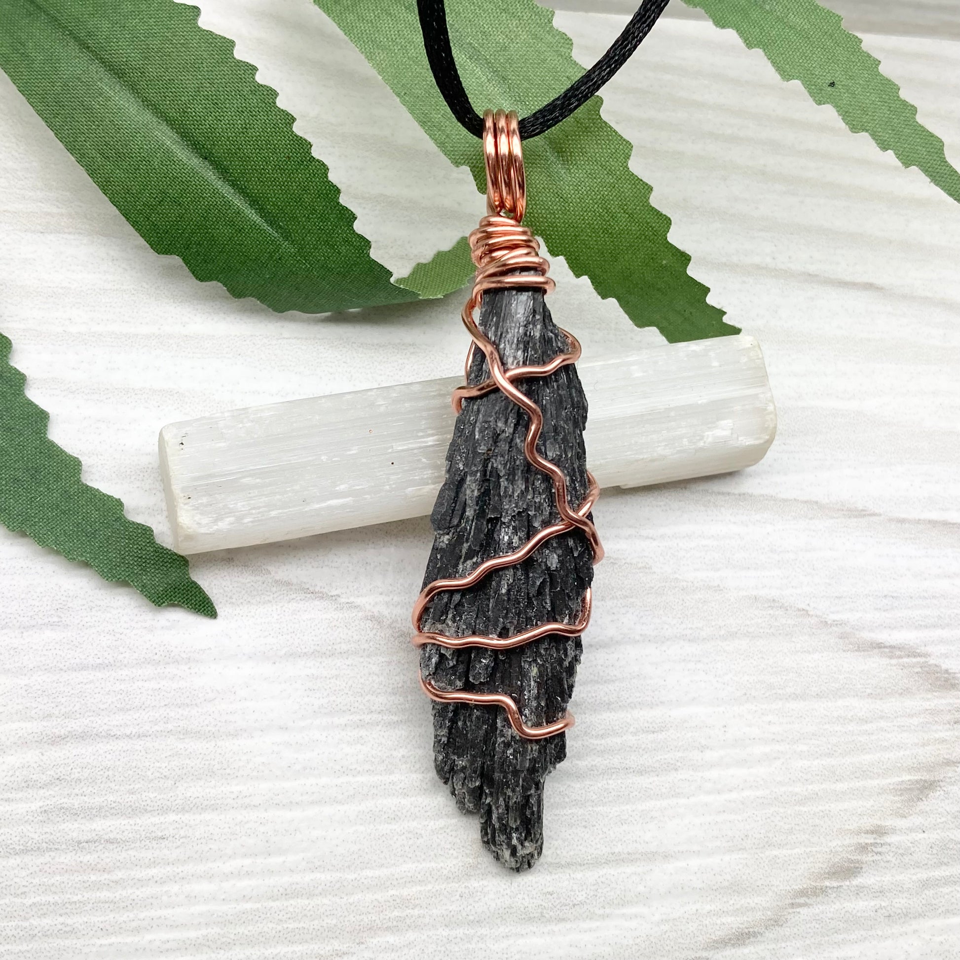 Black Kyanite necklace. Real raw Black Kyanite wrapped with tarnish resistant copper wire. Hangs on a black chain. Wire wrapped black crystal pendant. Spiritual gift.