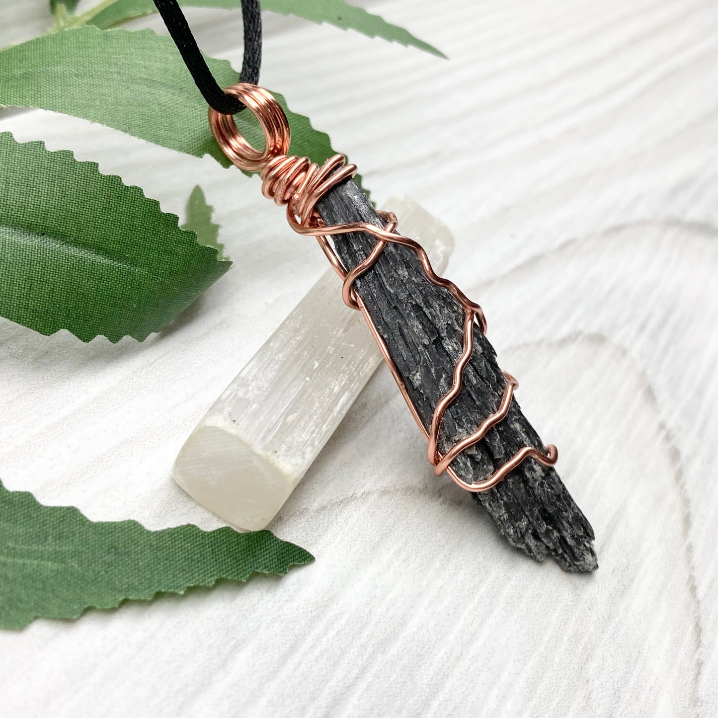 Black Kyanite necklace. Real raw Black Kyanite wrapped with tarnish resistant copper wire. Hangs on a black chain. Wire wrapped black crystal pendant. Spiritual gift.