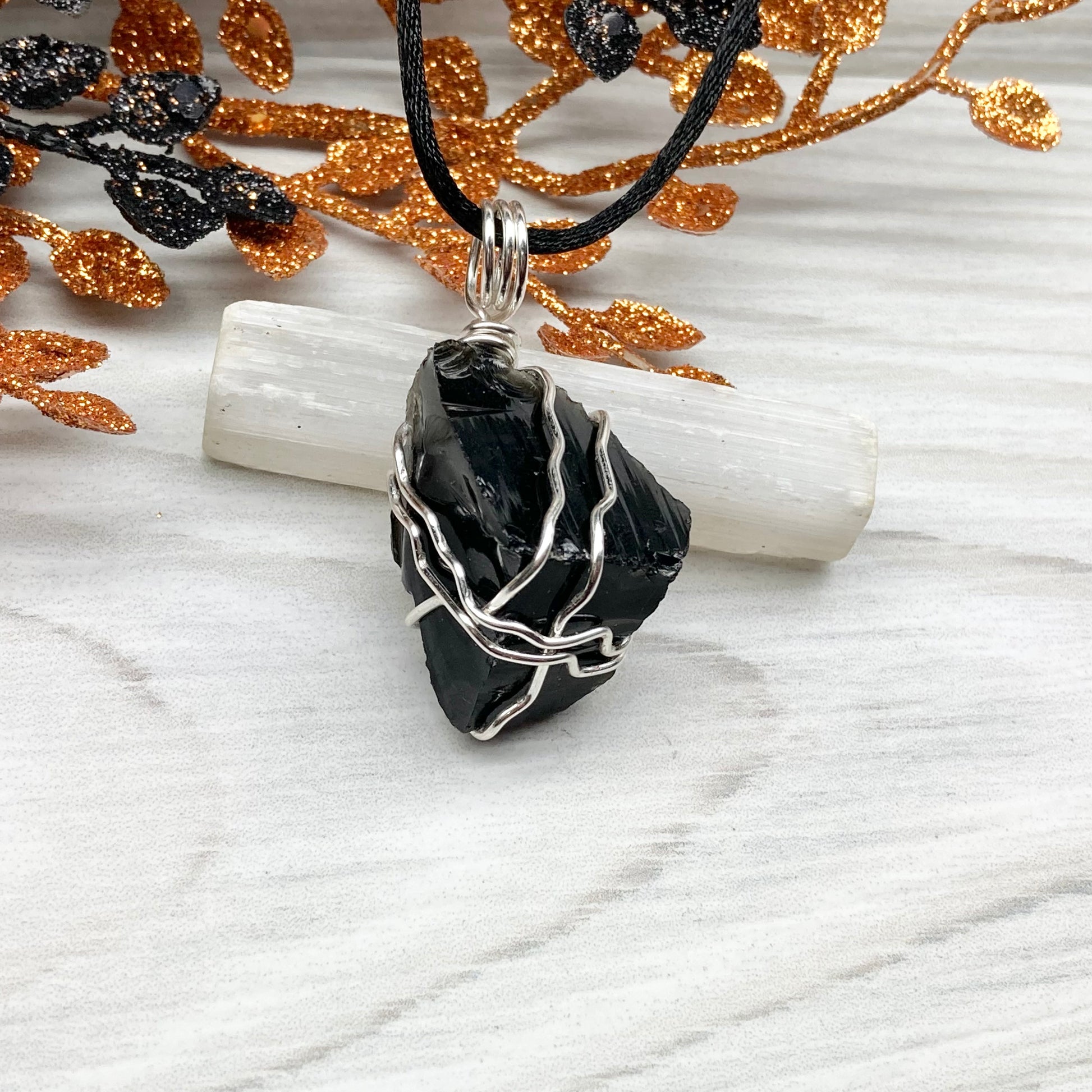 Real Black Obsidian necklace. Obsidian crystal wrapped with silver colored copper wire. Comes on a black chain. Raw Obsidian stone pendant. New age jewelry.