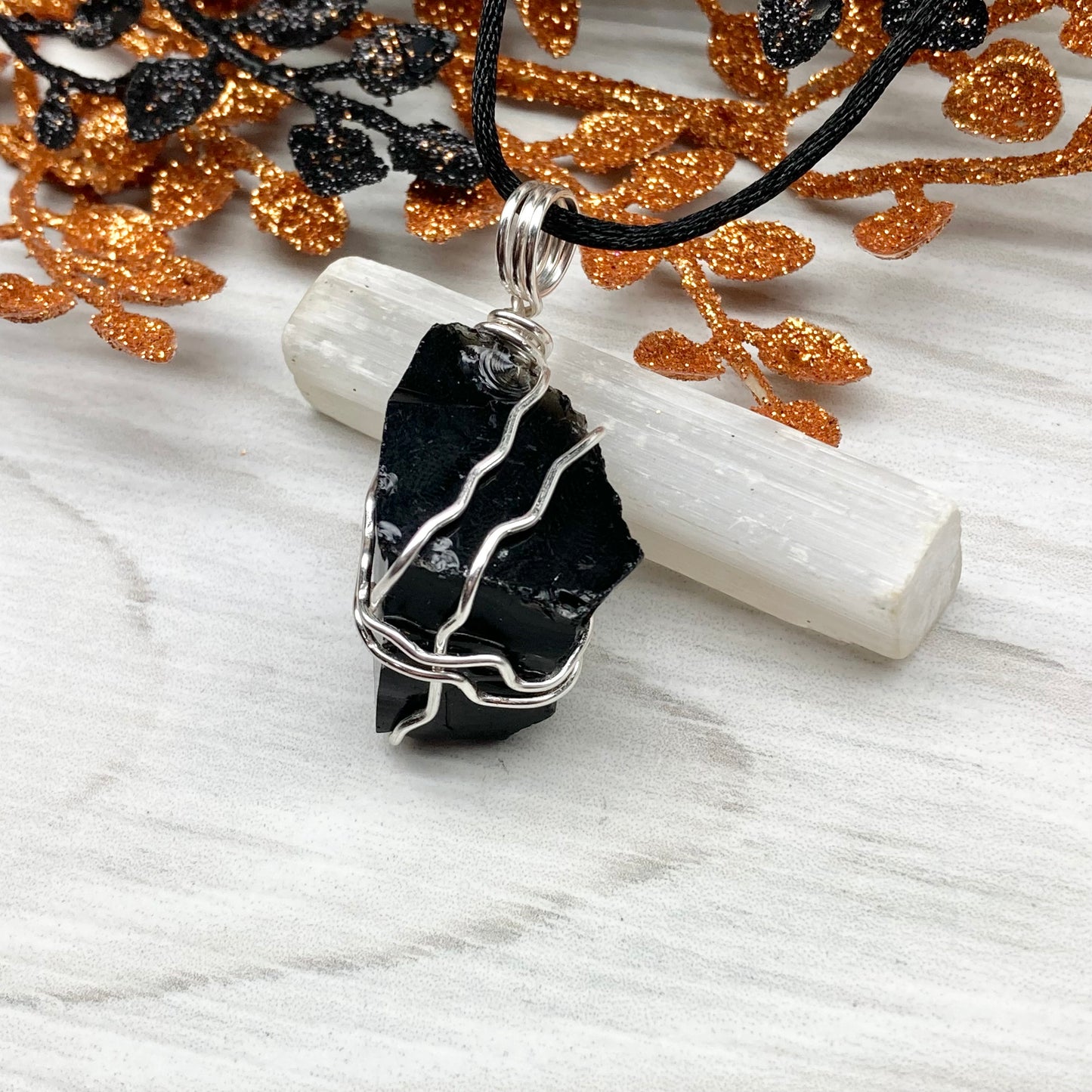 Real Black Obsidian necklace. Obsidian crystal wrapped with silver colored copper wire. Comes on a black chain. Raw Obsidian stone pendant. New age jewelry.