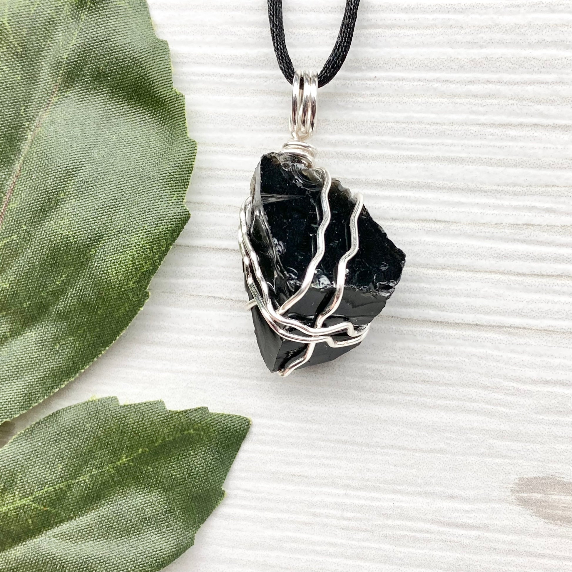 Real Black Obsidian necklace. Obsidian crystal wrapped with silver colored copper wire. Comes on a black chain. Raw Obsidian stone pendant. New age jewelry.