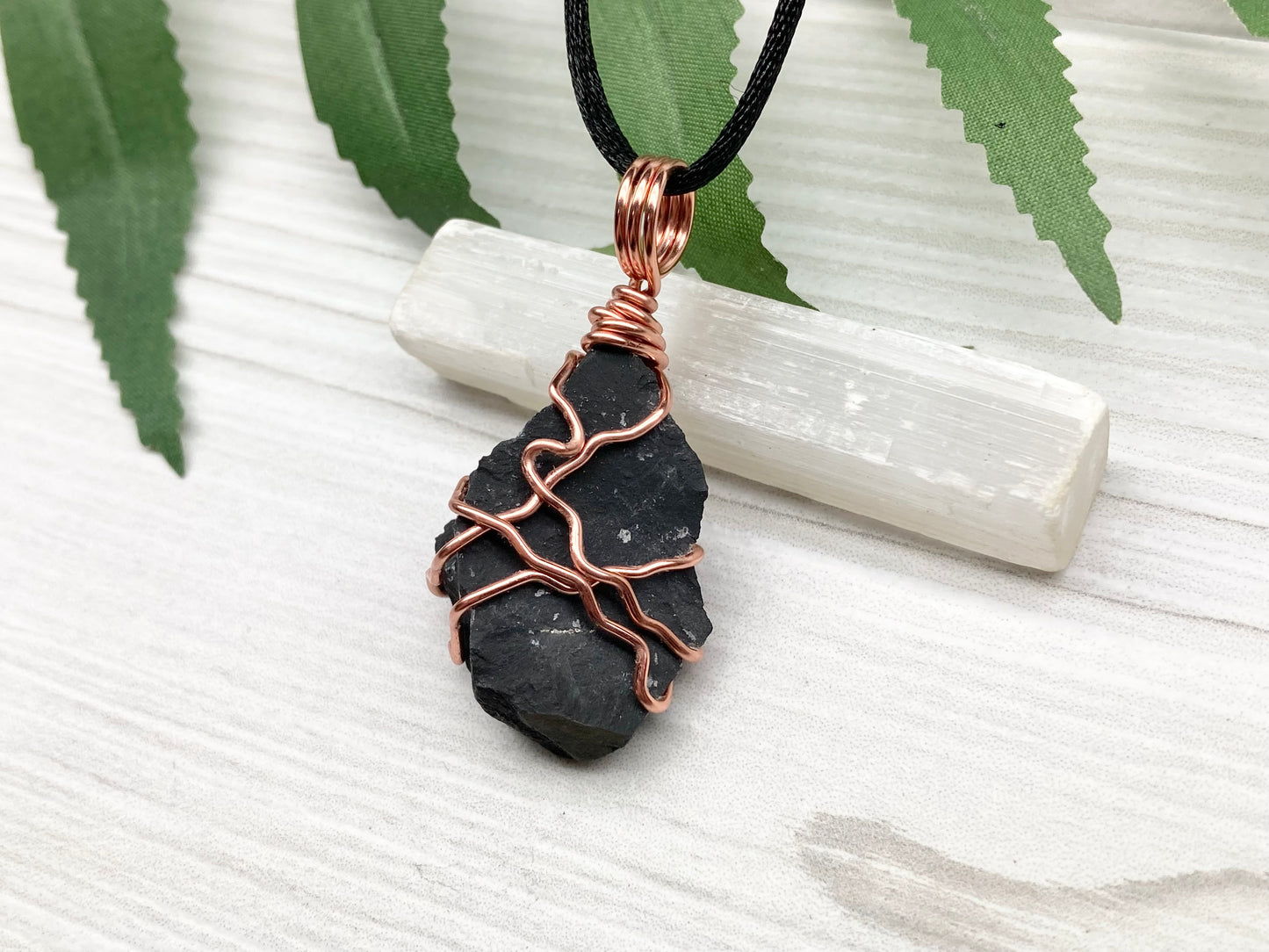 Black Onyx necklace. Raw Onyx wrapped with tarnish resistant copper wire. Comes on a black chain. Black stone wire wrapped pendant. 