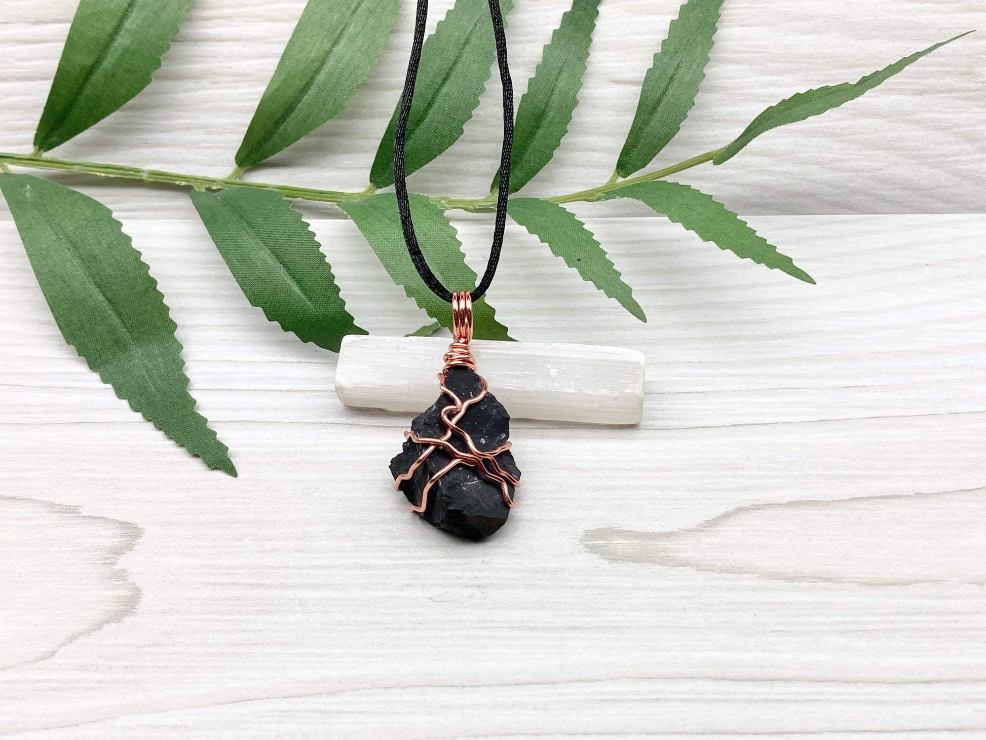 Black Onyx necklace. Raw Onyx wrapped with tarnish resistant copper wire. Comes on a black chain. Black stone wire wrapped pendant. 