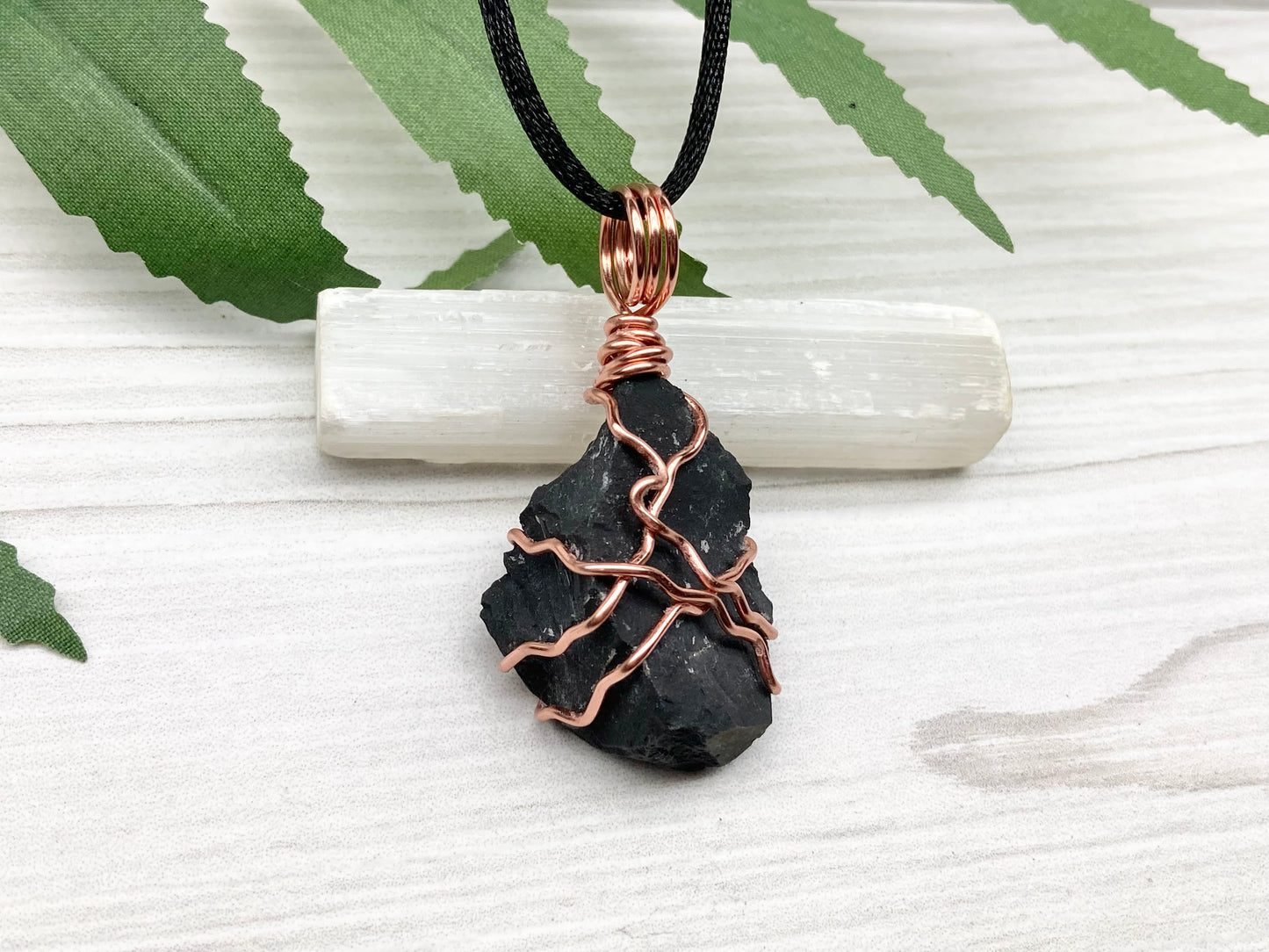 Black Onyx necklace. Raw Onyx wrapped with tarnish resistant copper wire. Comes on a black chain. Black stone wire wrapped pendant. 