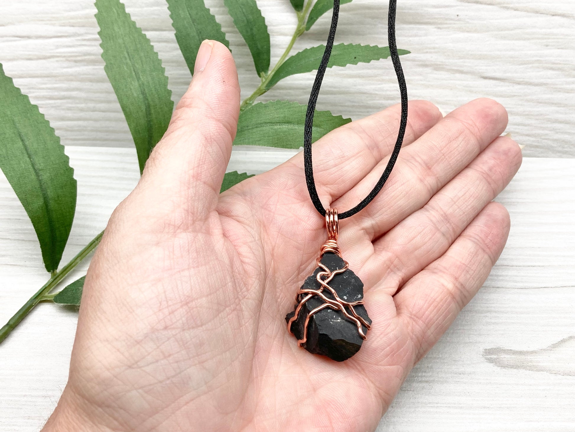 Black Onyx necklace. Raw Onyx wrapped with tarnish resistant copper wire. Comes on a black chain. Black stone wire wrapped pendant. 