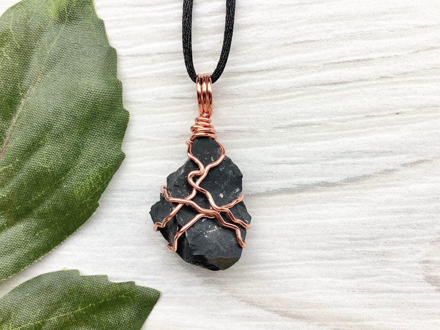 Black Onyx necklace. Raw Onyx wrapped with tarnish resistant copper wire. Comes on a black chain. Black stone wire wrapped pendant. 