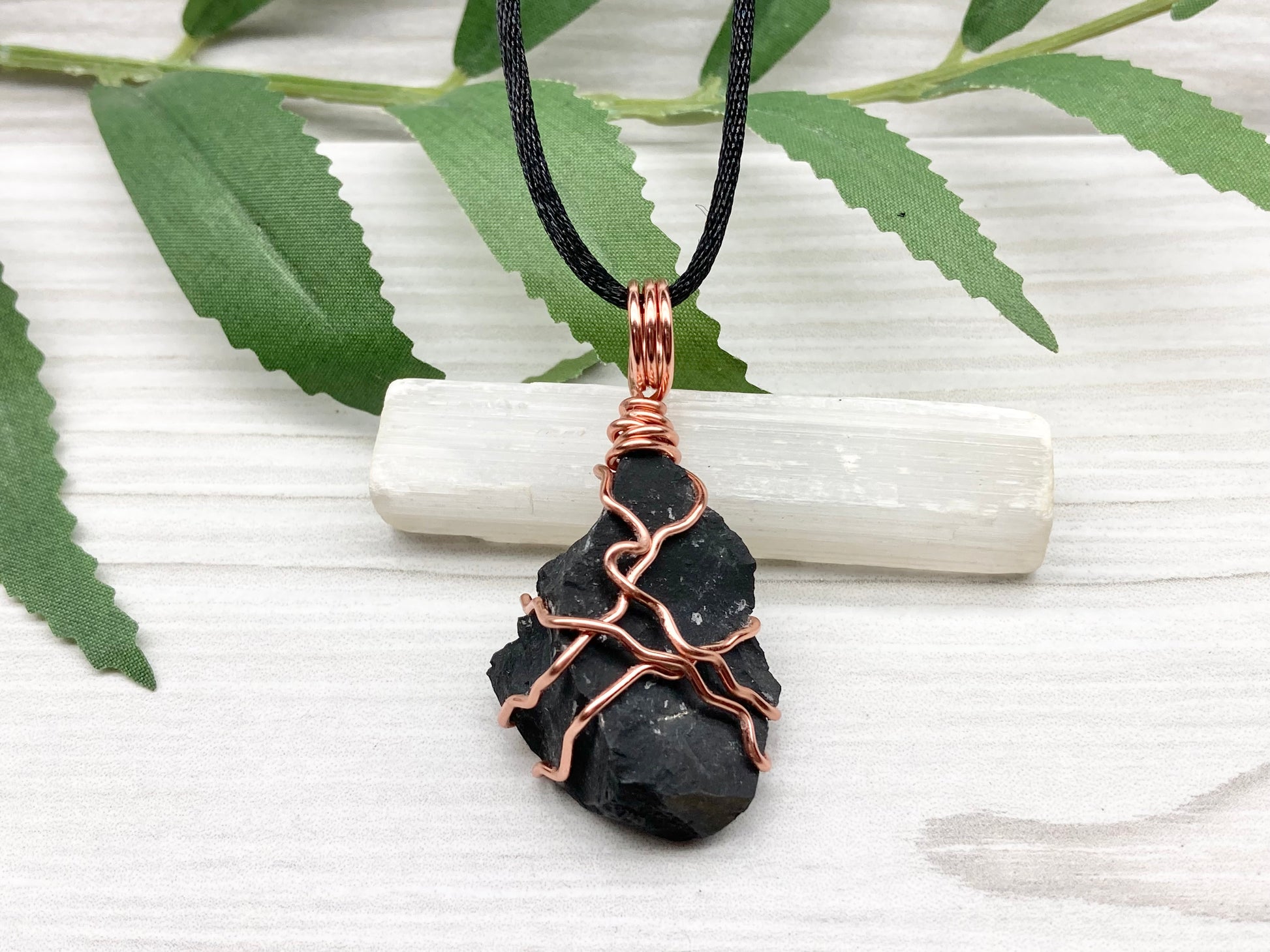 Black Onyx necklace. Raw Onyx wrapped with tarnish resistant copper wire. Comes on a black chain. Black stone wire wrapped pendant. 