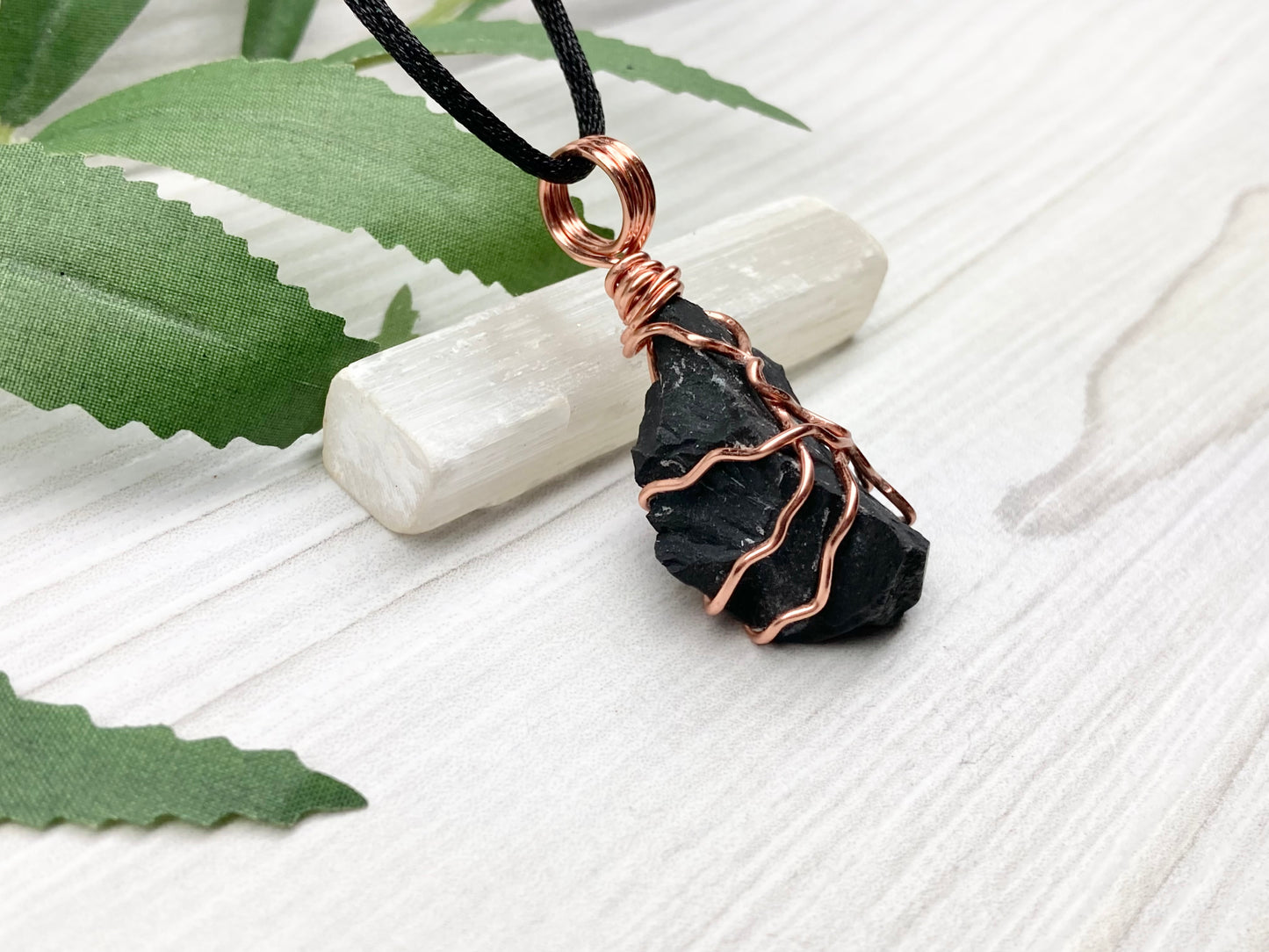 Black Onyx necklace. Raw Onyx wrapped with tarnish resistant copper wire. Comes on a black chain. Black stone wire wrapped pendant. 