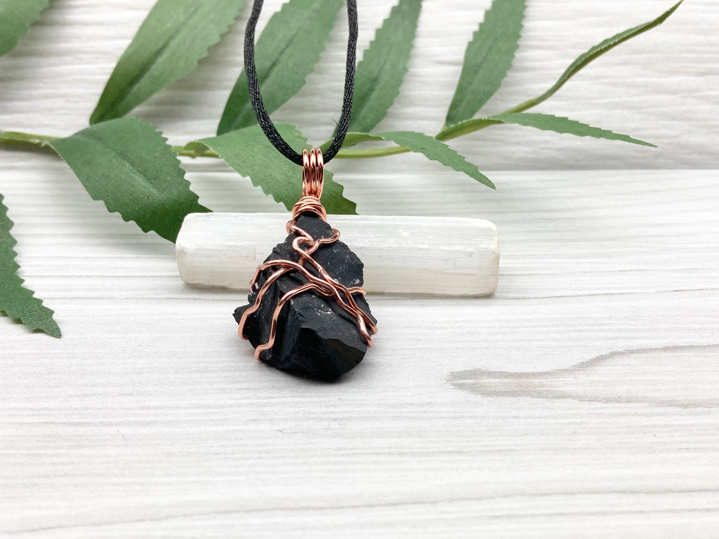 Black Onyx necklace. Raw Onyx wrapped with tarnish resistant copper wire. Comes on a black chain. Black stone wire wrapped pendant. 