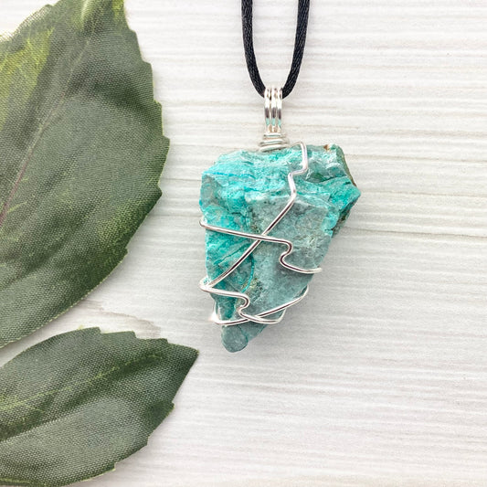 Chrysocolla Necklace. Raw Chrysocolla Crystal Wrapped With Silver Colored Copper Wire. This Stone Is A Beautiful Teal Color. Comes On A Black Chain.