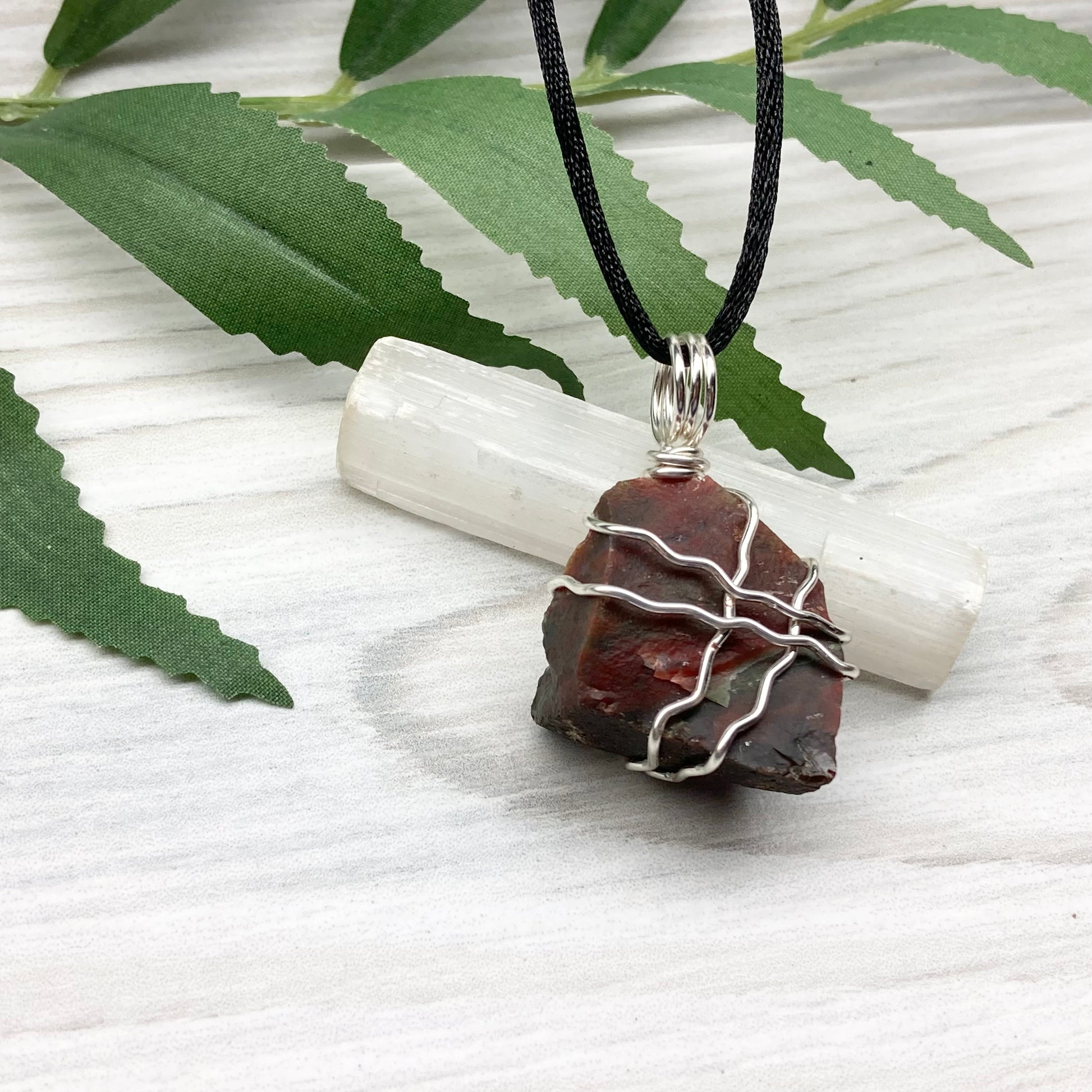 Fancy Jasper necklace. Raw Fancy Jasper stone wrapped with silver colored copper wire. Comes on a black chain. Wire wrapped crystal pendant. Green and red gemstone. Aries zodiac jewelry.