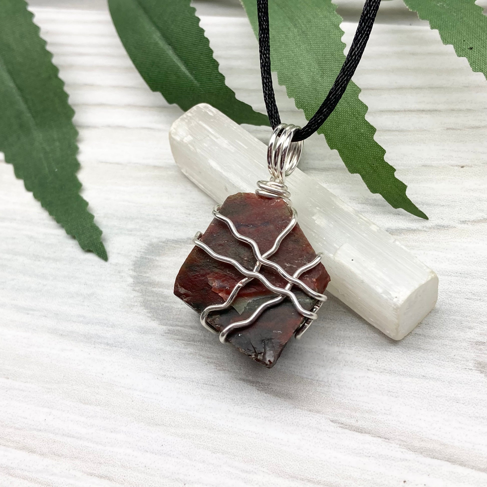 Fancy Jasper necklace. Raw Fancy Jasper stone wrapped with silver colored copper wire. Comes on a black chain. Wire wrapped crystal pendant. Green and red gemstone. Aries zodiac jewelry.