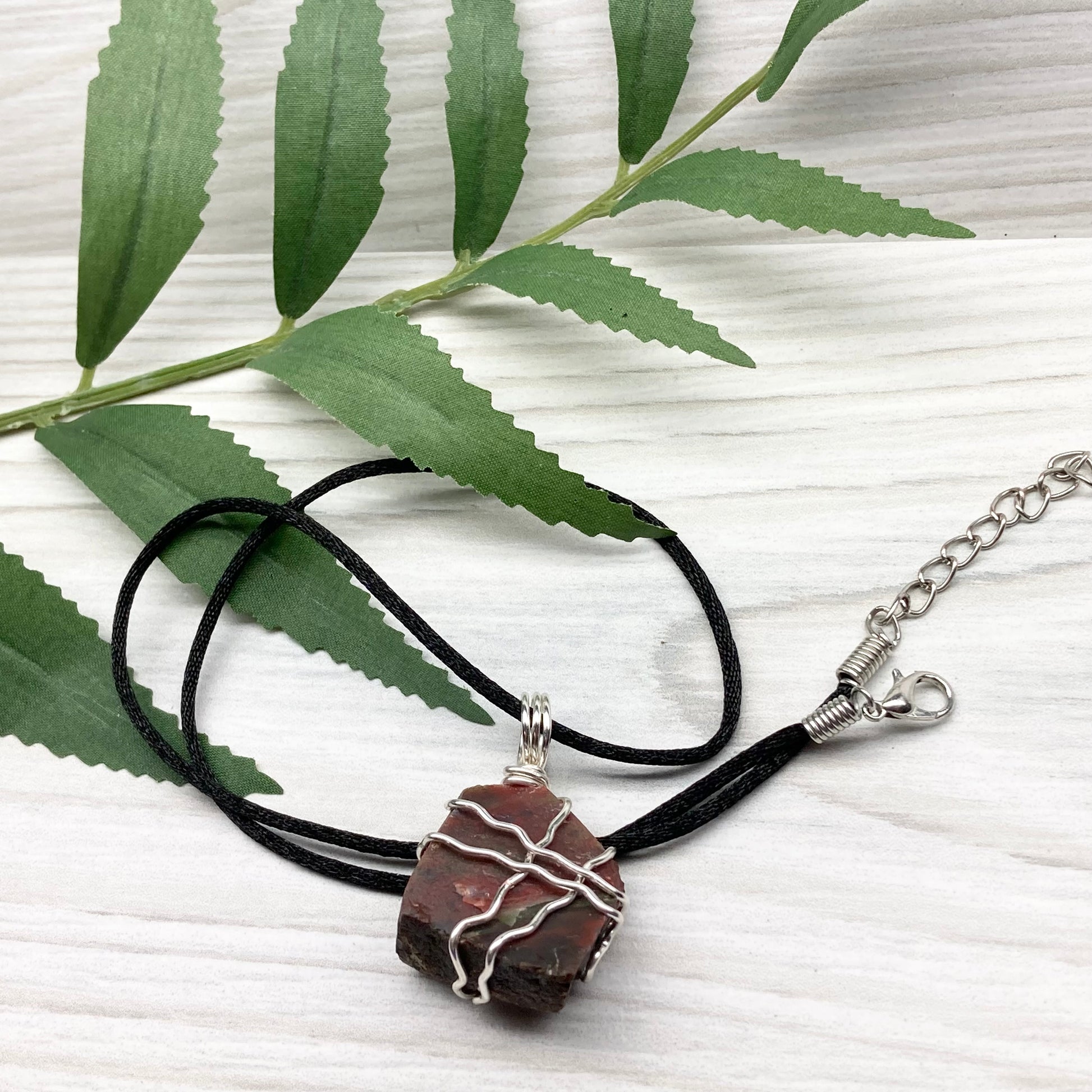 Fancy Jasper necklace. Raw Fancy Jasper stone wrapped with silver colored copper wire. Comes on a black chain. Wire wrapped crystal pendant. Green and red gemstone. Aries zodiac jewelry.