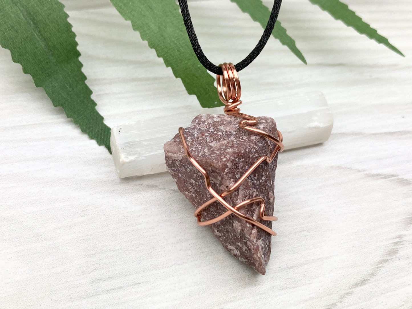 Natural Guava Quartz Necklace. This Crystal Is Hand Wrapped With Copper Wire. Stone is a Purple Brown Color. Comes On A Black Chain. Peace And Harmony Gemstone.