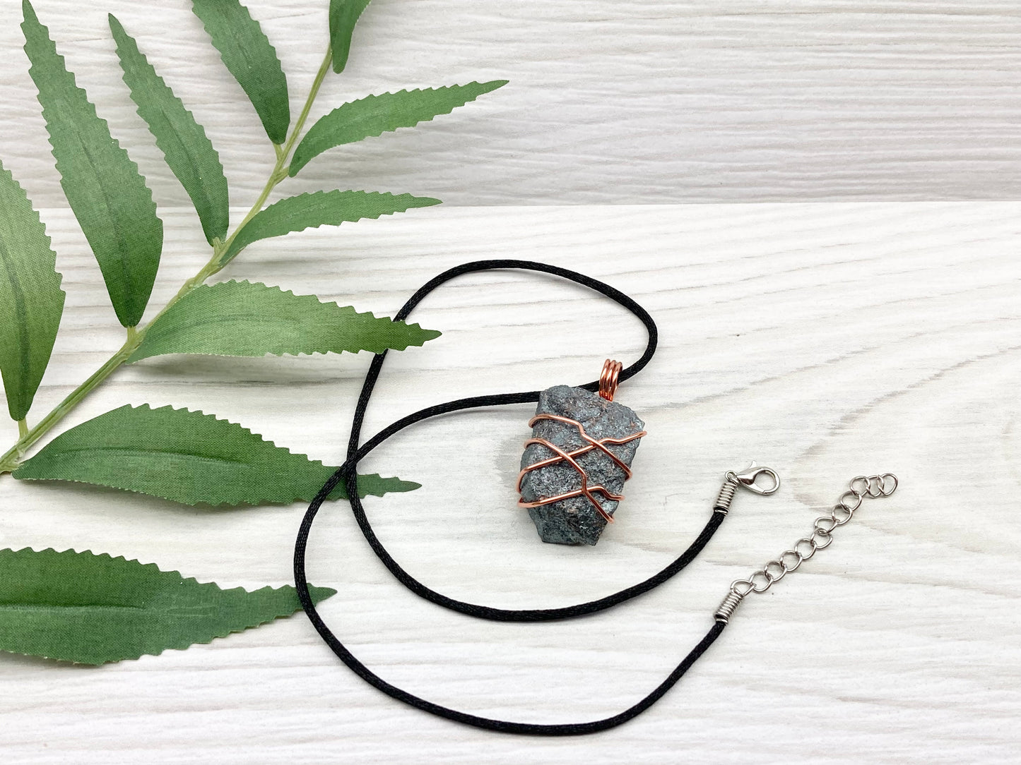 Raw Hematite Necklace. Gray Metallic Colored Stone Hand Wrapped With Pure Copper Wire. Comes On A Black Chain. New Age Jewelry For Him Or Her. Aquarius Zodiac Gemstone.