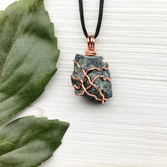 Raw Kambaba Jasper Necklace. Black and green stone wrapped with tarnish resistant copper wire. Comes on a black chain. Real crystal pendant. Wire wrapped jewelry. Handmade witchy gift.