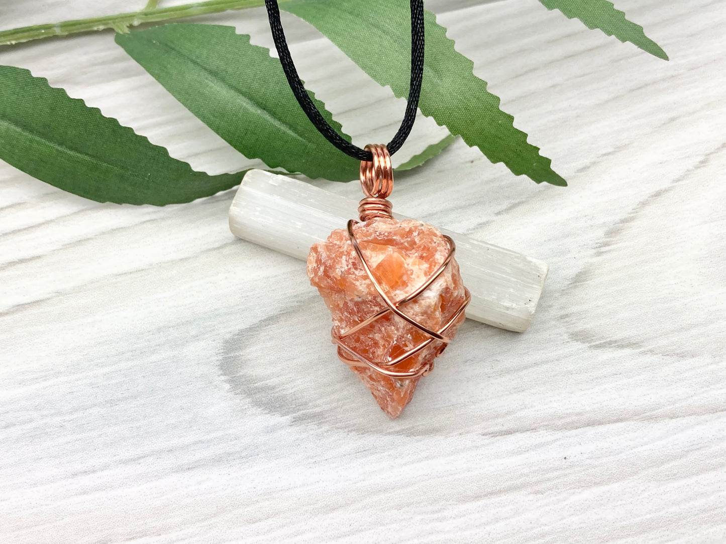 Orange Calcite Necklace. Raw Orange Calcite Crystal Wrapped With Copper Wire That Is Tarnish Resistant. Comes On A Black Necklace. Gemini Zodiac Stone Pendant. Handmade In Tennessee. Pagan Spiritual Jewelry.