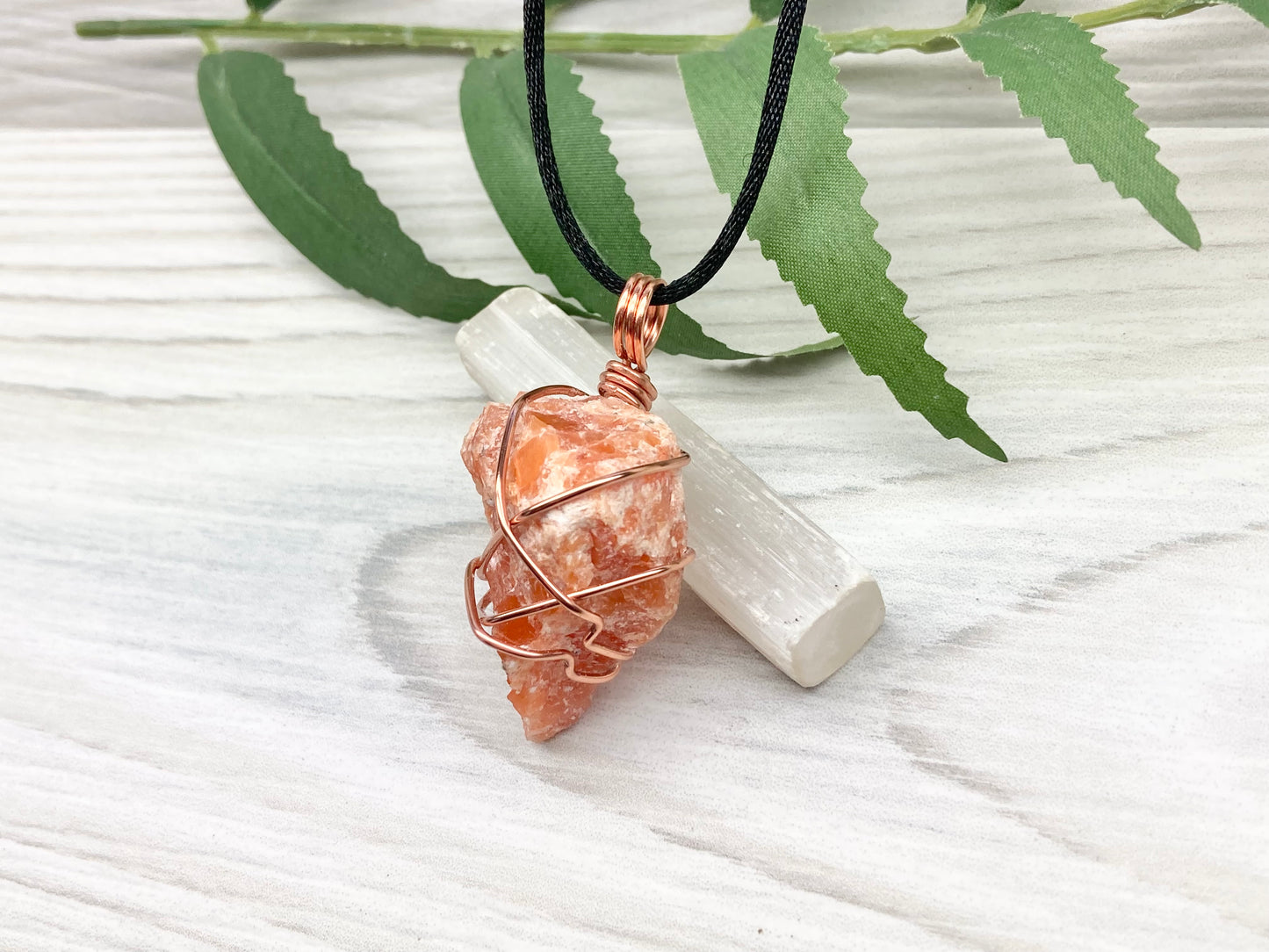 Orange Calcite Necklace. Raw Orange Calcite Crystal Wrapped With Copper Wire That Is Tarnish Resistant. Comes On A Black Necklace. Gemini Zodiac Stone Pendant. Handmade In Tennessee. Pagan Spiritual Jewelry.