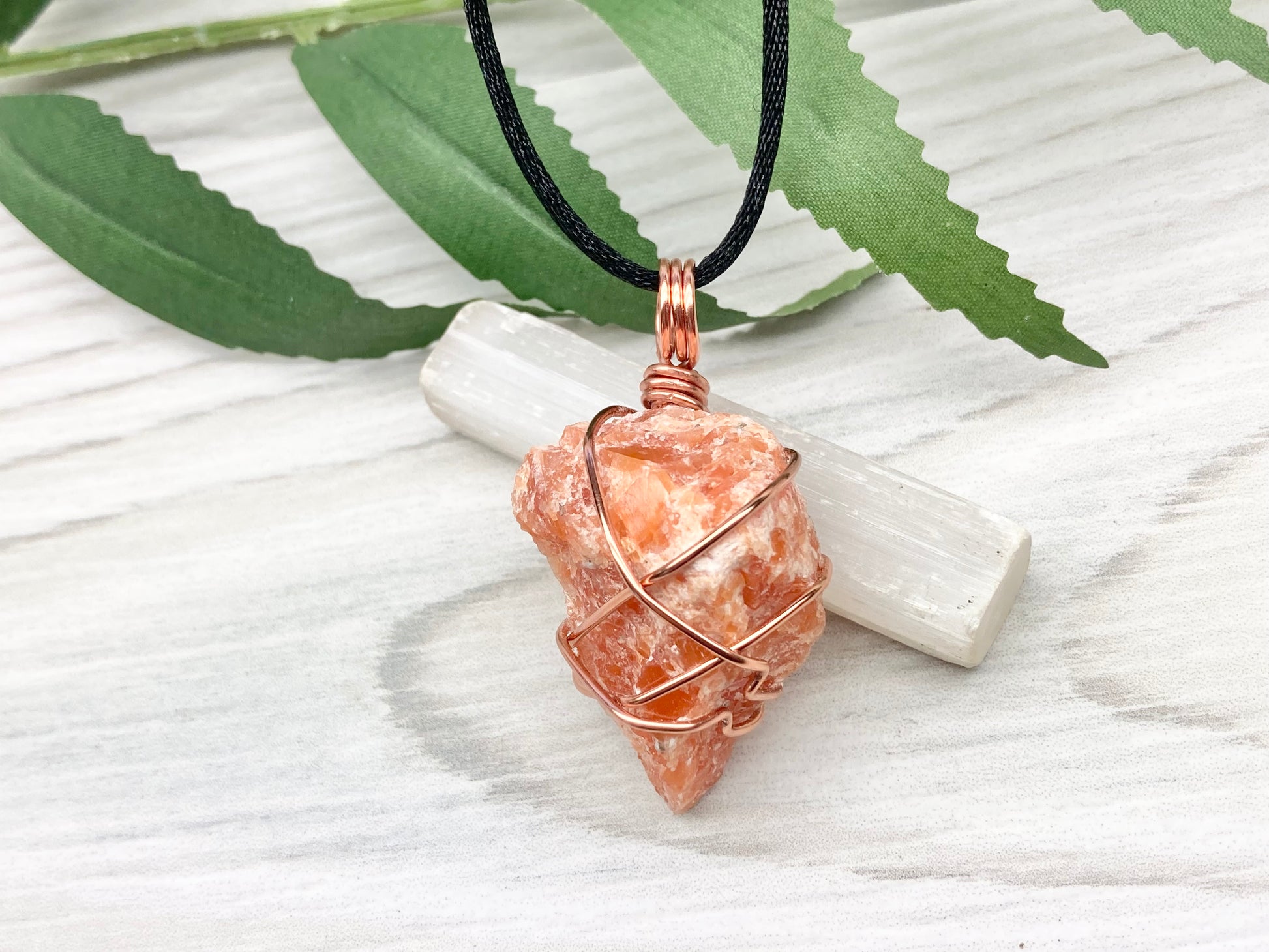 Orange Calcite Necklace. Raw Orange Calcite Crystal Wrapped With Copper Wire That Is Tarnish Resistant. Comes On A Black Necklace. Gemini Zodiac Stone Pendant. Handmade In Tennessee. Pagan Spiritual Jewelry.