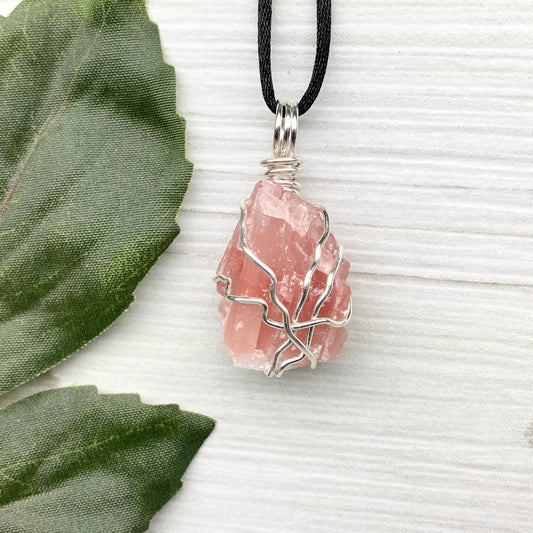 Pink Calcite Necklace. Raw pink crystal wrapped with silver copper wire. Comes on a black chain. Inner peace stone. Stone pendant gift for wife. Girly boho jewelry.