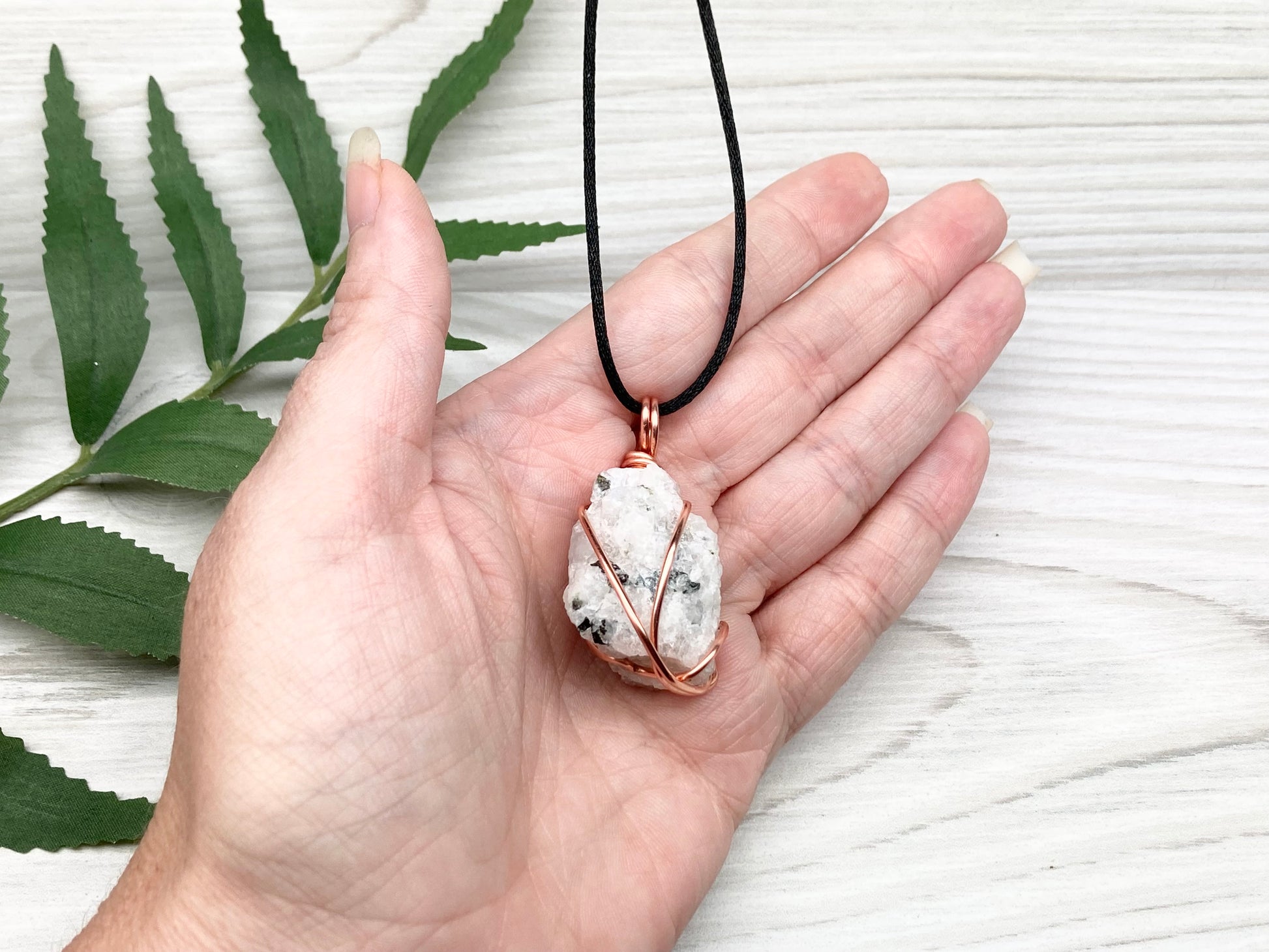 Rainbow Moonstone Necklace. White And Black Crystal Wrapped With Copper Wire. Comes On A Black Chain. This Stone Is Associated With The Third Eye Chakra.