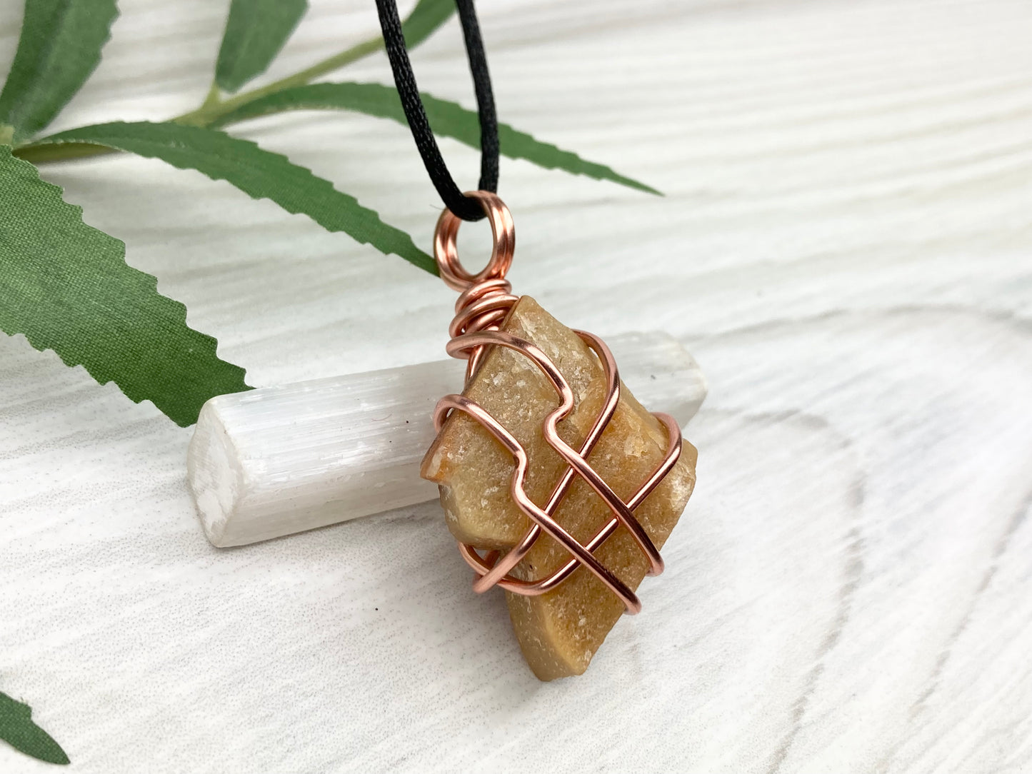 Yellow aventurine necklace. Yellow raw stone wrapped with copper wire. Comes on a black necklace. Handcrafted new age jewelry.