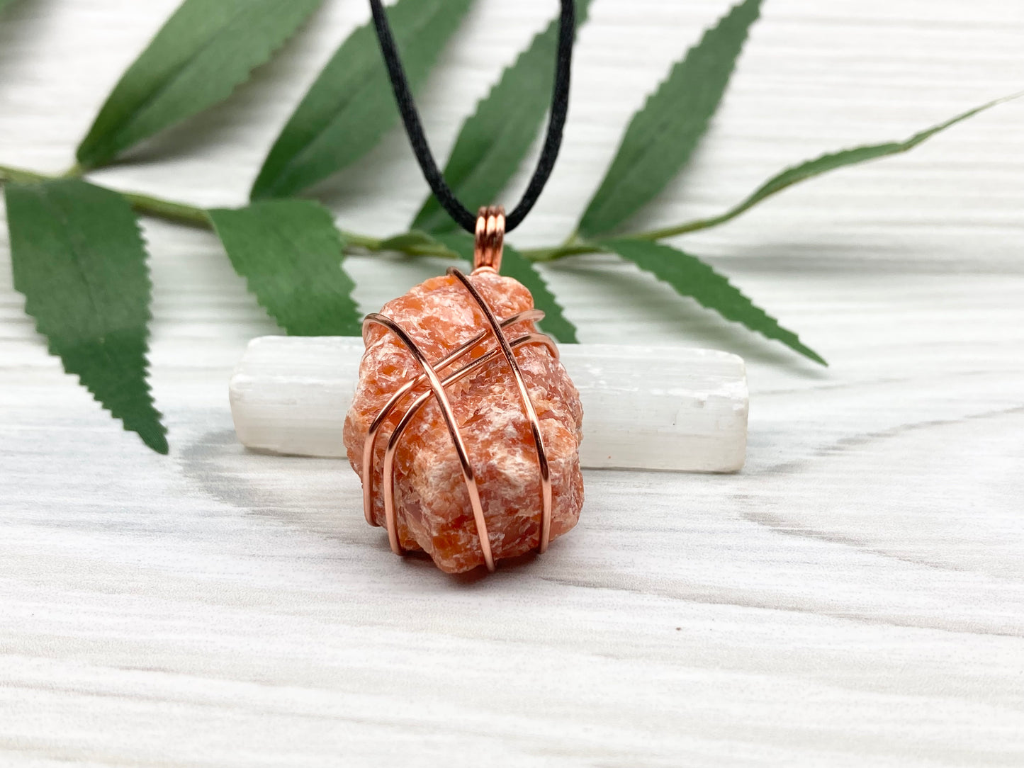 Raw Orange Calcite Necklace. Natural Orange Crystal Hand Wrapped With Copper Wire. Comes On A Black Chain. Leo Zodiac Stone Pendant. New Age Metaphysical Jewelry. Fire Element Gemstone.