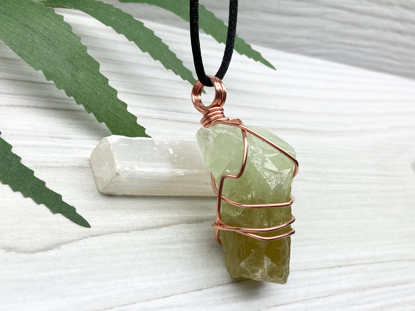 Green Calcite Necklace. Copper Wire Wrapped Stone Pendant. Raw Green Crystal. Stone Has Light Green At The Top And Dark Green At The Bottom. Comes On A Black Chain. Hand Crafted Spiritual Jewelry For Him Or Her.