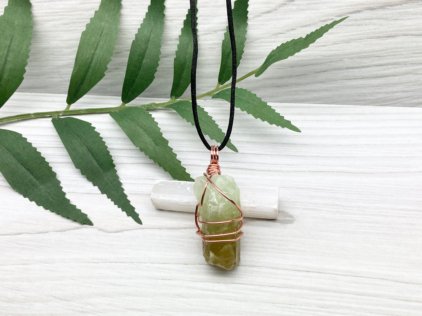 Green Calcite Necklace. Copper Wire Wrapped Stone Pendant. Raw Green Crystal. Stone Has Light Green At The Top And Dark Green At The Bottom. Comes On A Black Chain. Hand Crafted Spiritual Jewelry For Him Or Her.