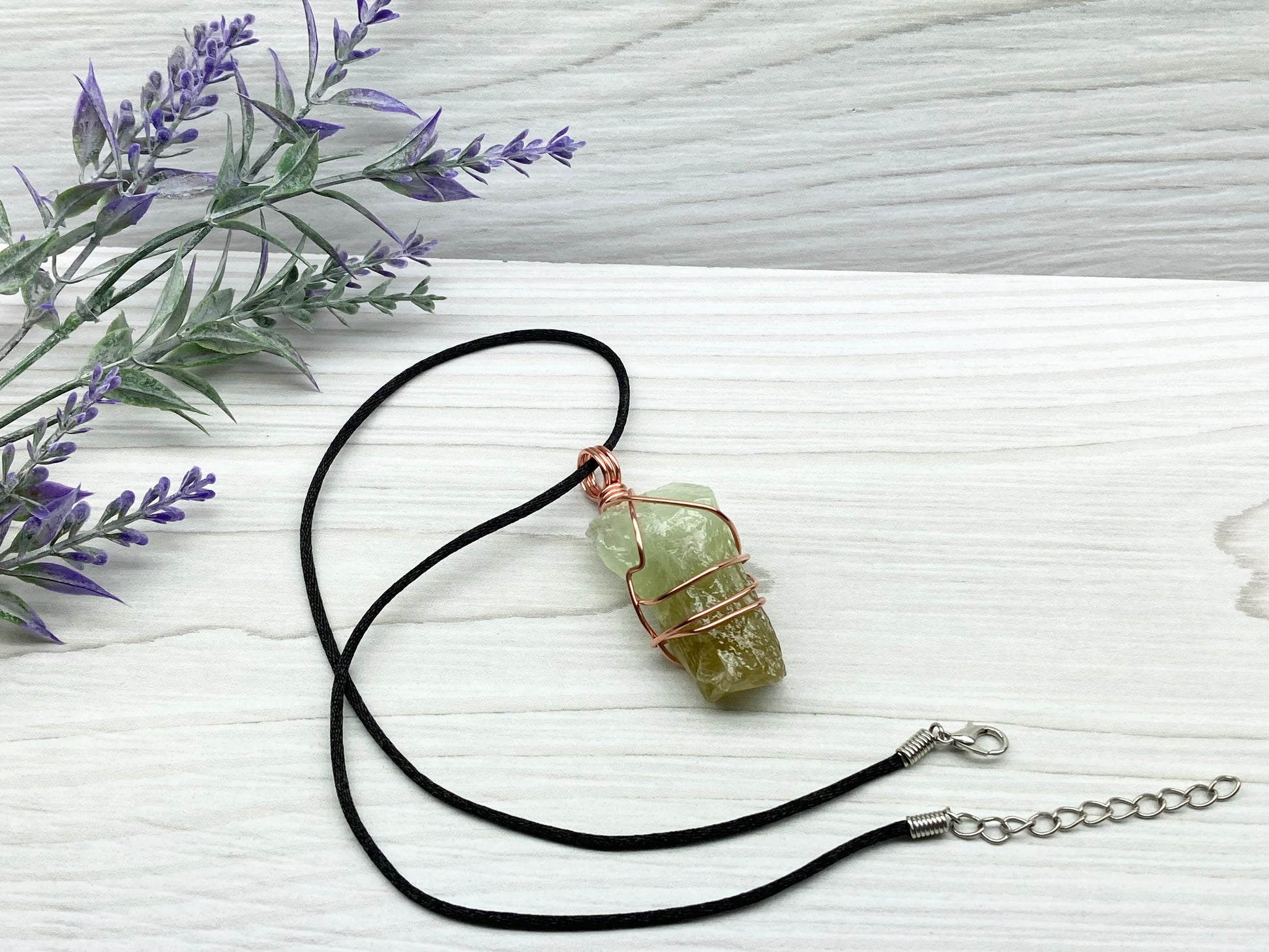 Green Calcite Necklace. Copper Wire Wrapped Stone Pendant. Raw Green Crystal. Stone Has Light Green At The Top And Dark Green At The Bottom. Comes On A Black Chain. Hand Crafted Spiritual Jewelry For Him Or Her.