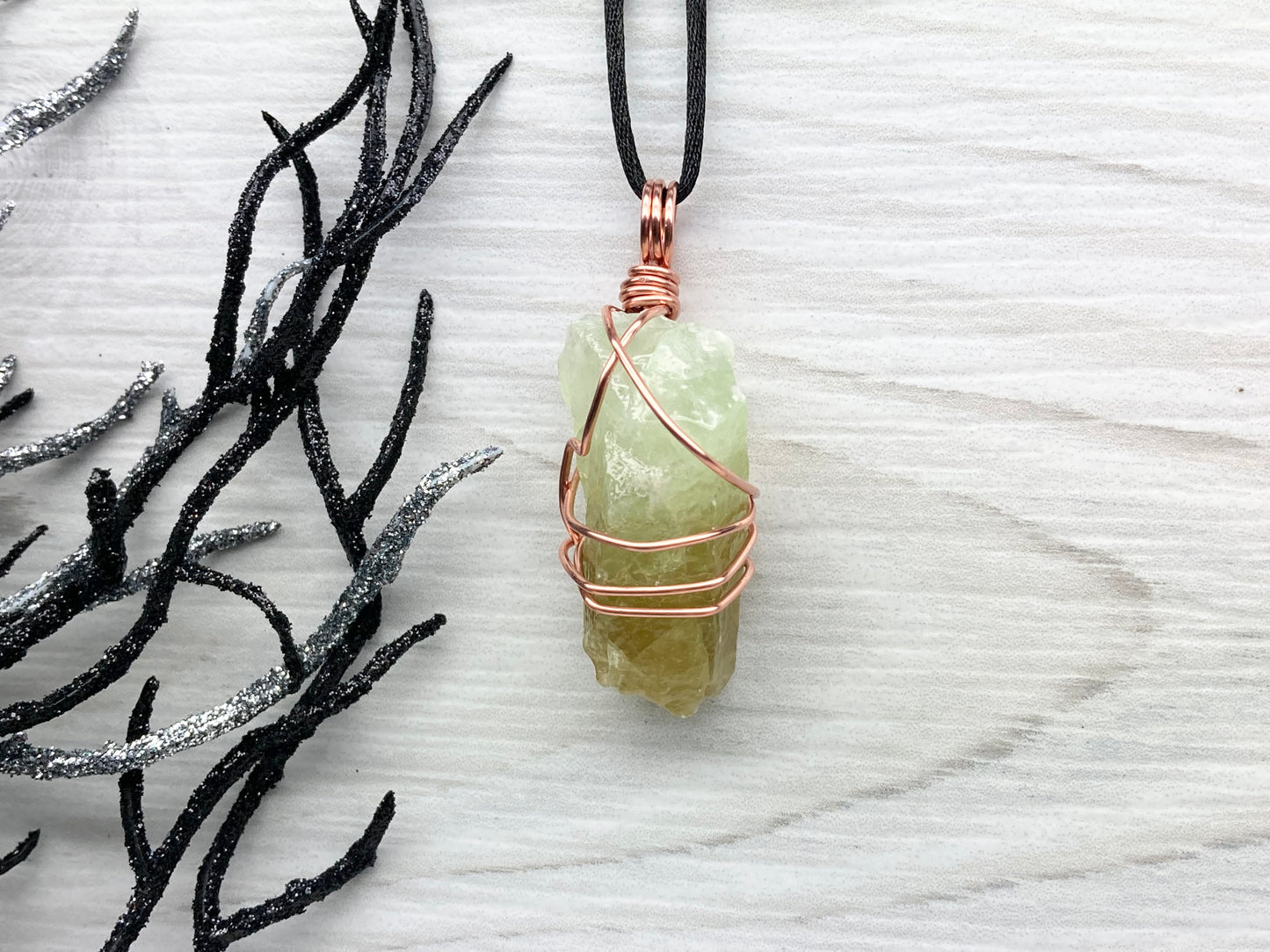 Green Calcite Necklace. Copper Wire Wrapped Stone Pendant. Raw Green Crystal. Stone Has Light Green At The Top And Dark Green At The Bottom. Comes On A Black Chain. Hand Crafted Spiritual Jewelry For Him Or Her.