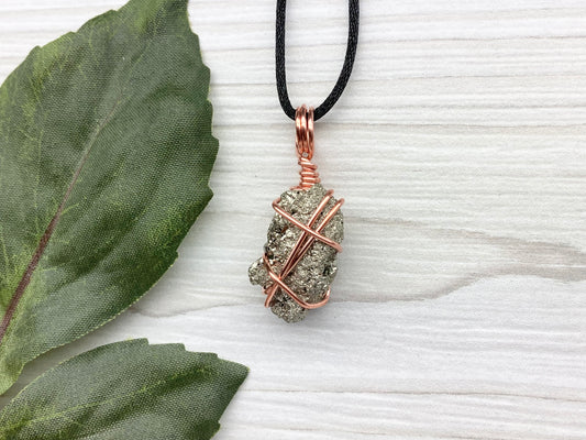 Raw Pyrite Necklace. Real Pyrite Stone Hand Wrapped With Copper Wire. Fools Gold Crystal Pendant. Comes On A Black Chain. Leo And Taurus Zodiac Jewelry. Handmade In Tennessee.